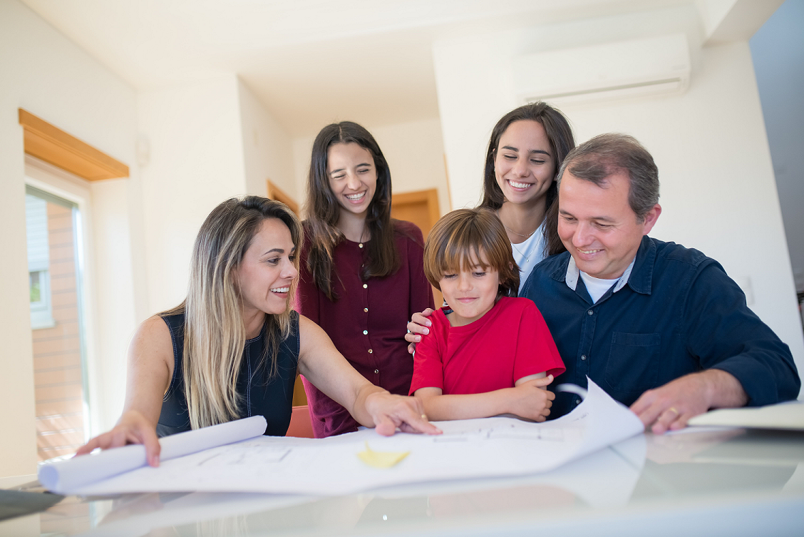 family looking at plans for home renovations
